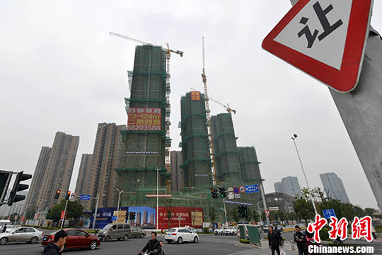 資料圖：一處商品房在建中。 <a target='_blank' href='http://www.chinanews.com/'>中新社</a>記者 呂明 攝