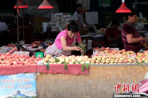 資料圖：菜市場商家。<a target='_blank' href='http://www.chinanews.com/'>中新社</a>記者 張遠(yuǎn) 攝